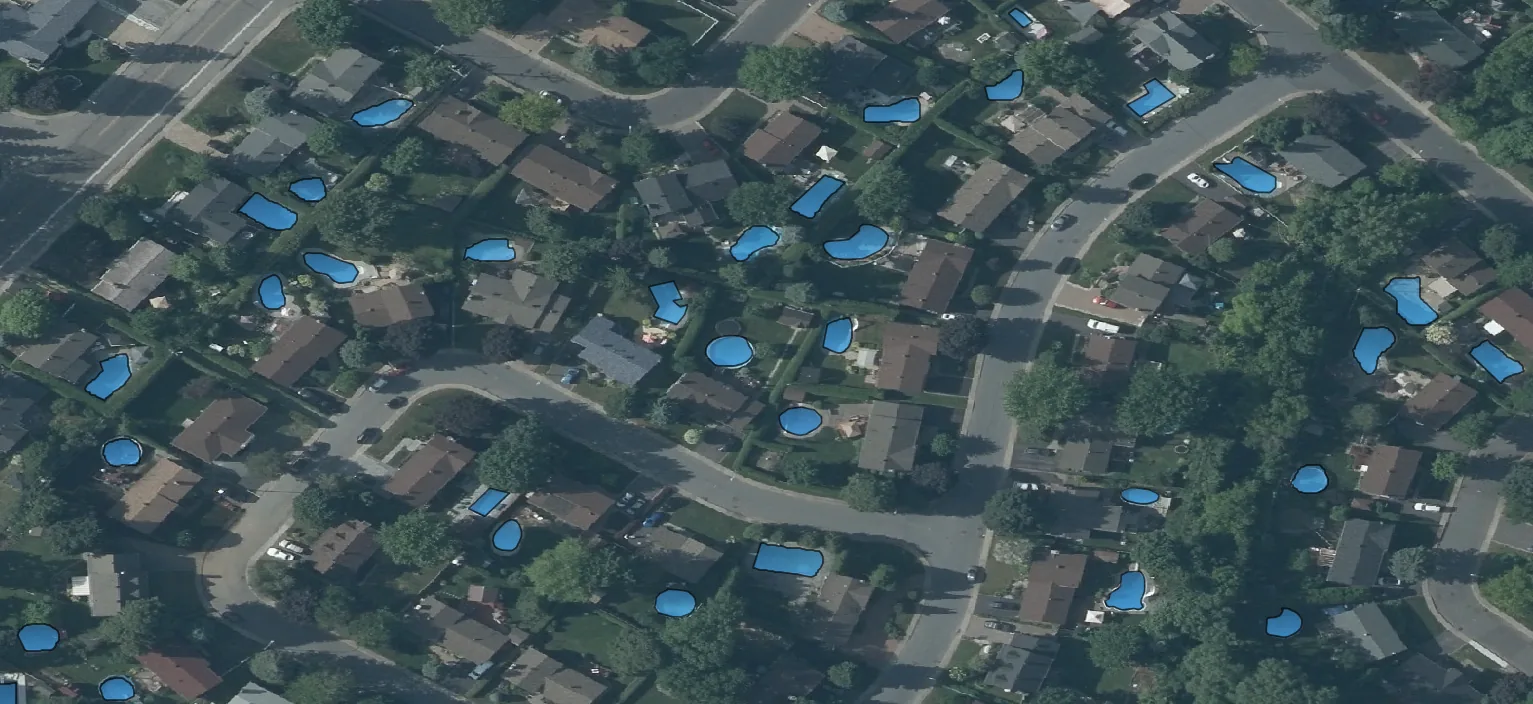 Detected pools and outdoor property features over aerial imagery